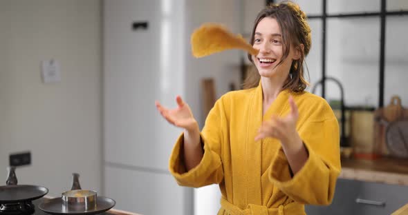 Woman Cooks Pancakes for Breakfast