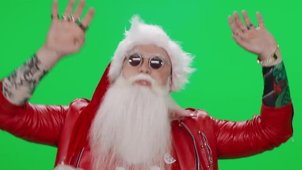 Freaky Santa Claus Dances on a Green Background Funny Santa Arranges a Performance Chroma Key