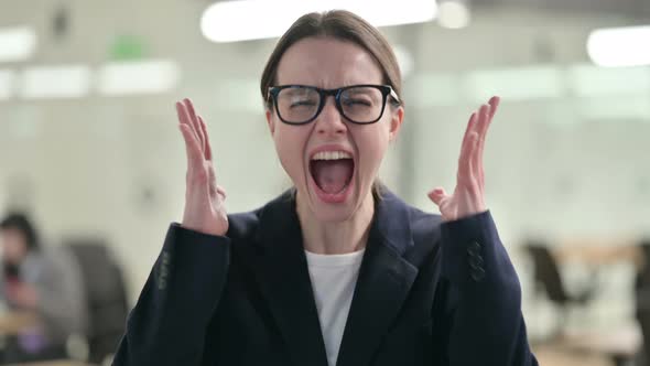 Portrait of Attractive Young Businesswoman Screaming, Shouting 