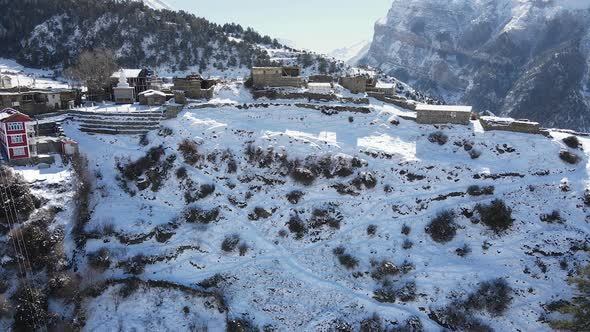 Aerial view of Ngawal Village covered in snow in the Himalayas