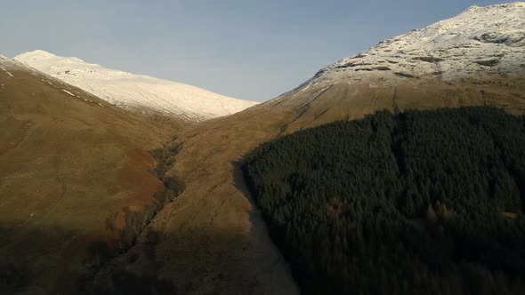 Aerial View of a Valley in Scotland with Forests