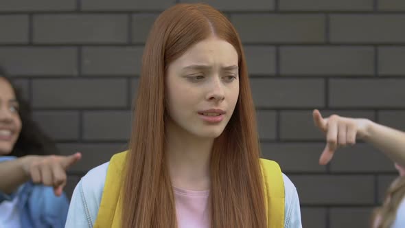 Cruel Teens Pointing at Ginger Girl, Teasing About Red Hair, School Bullying