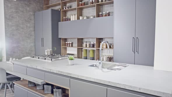 Tracking shot of a luxury kitchen with gray modern design