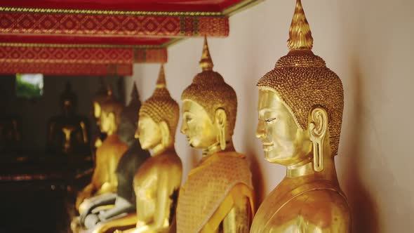 Close Up Gold Leaf Buddha Statues in Bangkok, Thailand at Buddhist Temple, Buddhist Statues Portrait