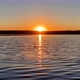 Sunrise over the river near the shore. Rising sun in clear sky. Timelapse - VideoHive Item for Sale