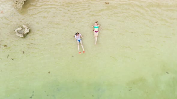 Tourists Relax on a Sandy Beach Top View