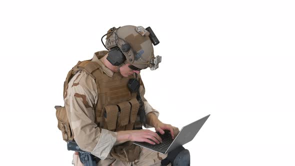 Soldier Using Laptop Computer for Surveillance During Military Operation on White Background