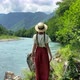 Young beautiful romantic vintage woman in straw hat going to stone coast near mountain river, travel - VideoHive Item for Sale