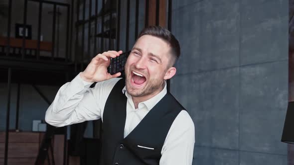 Successful Happy Businessman Luxurious Black Suit is Dialing Calling Through His Modern Smartphone