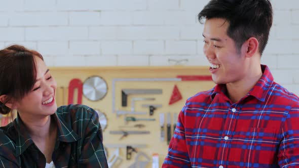 Close up of Two attractive Carpenter designing and discussion together on the table