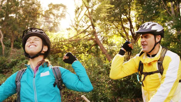 Mountain biking couple clenching fist