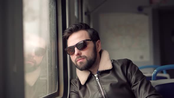 Sad Man Looking On Train Window Worried On Problem. Depressed Man Under Stress Work After Fired Job.