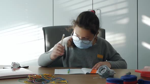 Masked Child in a School Class