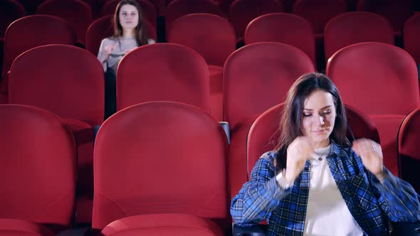 Fast Motion of People Coming Into a Cinema Hall and Putting on Glasses