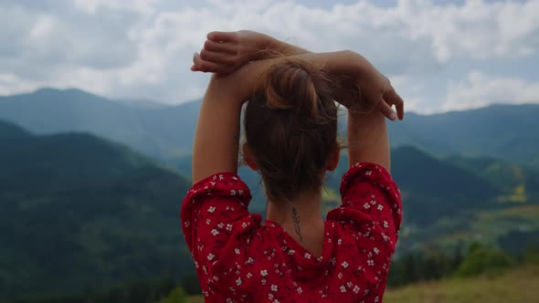 Back View Woman Raising Hands Standing in Front Beautiful Mountains Close Up