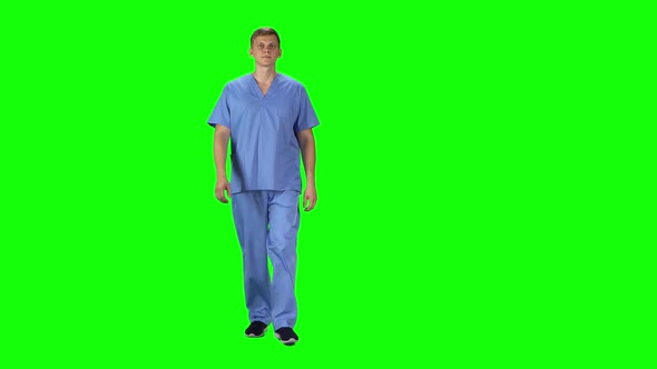 Medical Man Going and Looking Forward Against a Green Background.