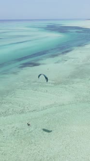 Vertical Video Kitesurfing Near the Shore of Zanzibar Tanzania