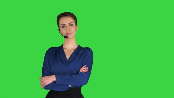 Call Center Woman with Headset Posing To Camera on a Green Screen, Chroma Key