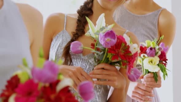 Happy bridesmaids in grey dresses holding flowers 4K 4k