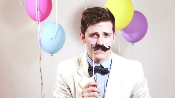 Close up portrait of man with moustache in photo booth