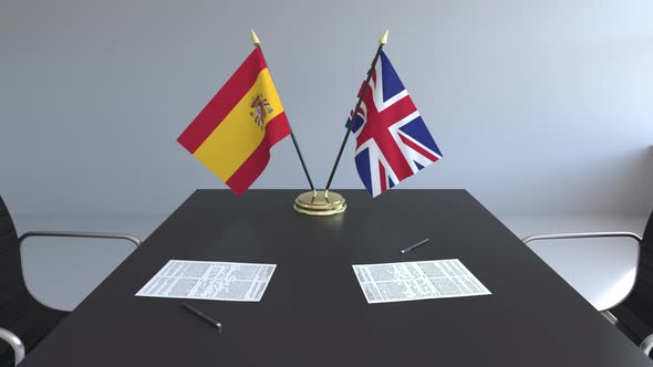 Flags of Spain and the United Kingdom on the Table alt