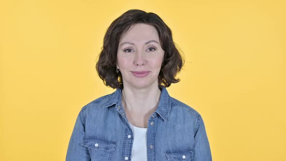 Yes Old Woman Shaking Head on Yellow Background