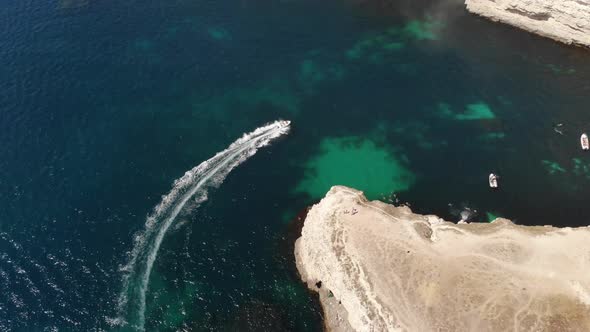 Aerial View of a Small Speed Boat in the Bay