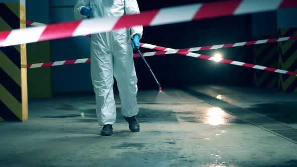 Worker in Hazmat Disinfects Room. Coronavirus Prevention, Covid-19 Protective Disinfection.