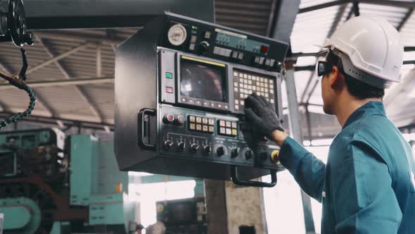 Smart Factory Worker Using Machine in Factory Workshop