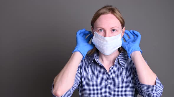 The girl protects herself from viruses with a medical mask. covid-19 virus protection concerns