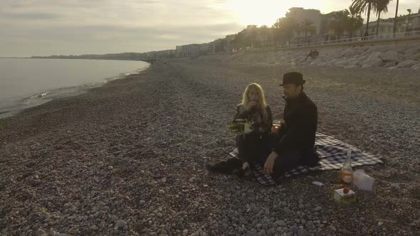 Man and Woman Drinking Wine on Sea Shore in Nice, Luxurious Weekend Getaway