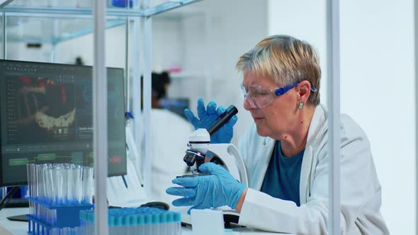 Elderly Biotechnology Scientist Researching in the Laboratory