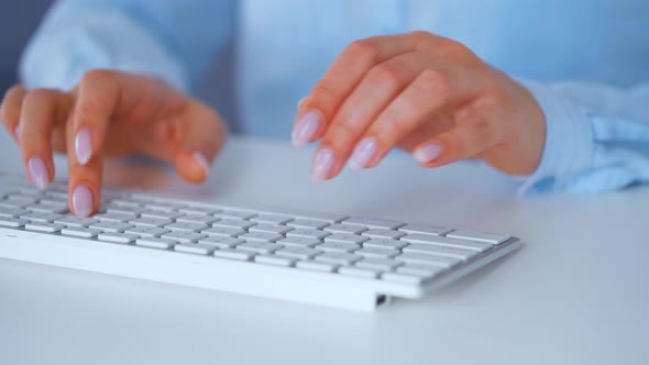 Female Hands Typing on a Computer Keyboard. Concept of Remote Work.