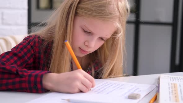 Blonde Schoolgirl Studying at Home Doing School Homework