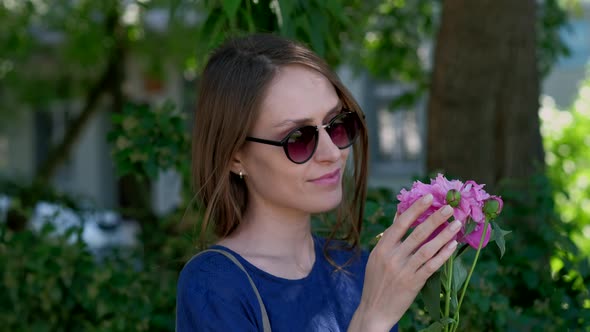 Young Woman with Peony Flower