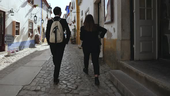 Family Couple of Students in Suits on Tourist Walk