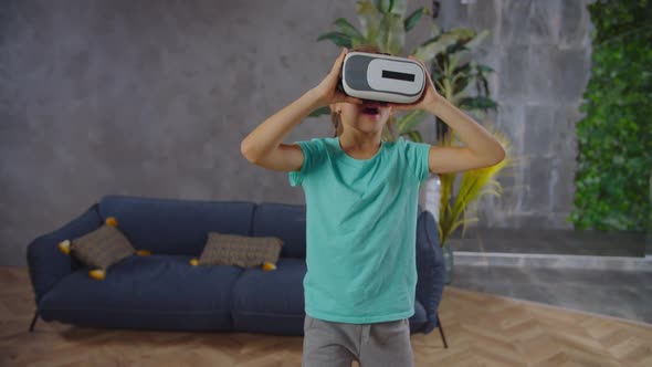 Little Girl in Virtual Reality Headset Playing Videogame alt