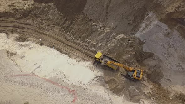 Excavator Load the Sand Into Dump Truck