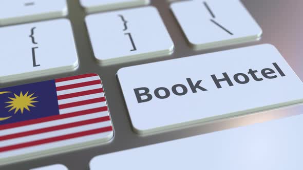 BOOK HOTEL Text and Flag of Malaysia on Computer Keyboard alt