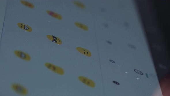 A Woman Types Emojis on a Tablet - Closeup From the Side