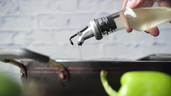 Detail Shot of Pouring Vegetable Oil Into Frying Pan