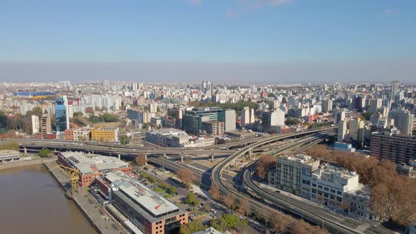 Aerial view of a highway crossing through a neighborhood in Buenos Aires city at daytime