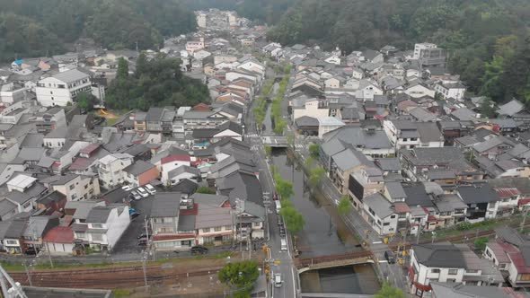 Early morning aerial shot of Kinosaki Onsen, famous small hot spring town in Hyogo prefecture, tilt