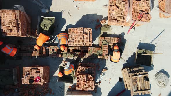 Aerial Top View of Builders Building a House