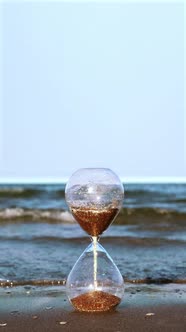 Hourglass Flows on the Beach to the Sea