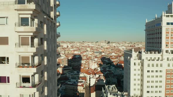 Aerial Ascending Footage Along Wall with Windows and Balconies