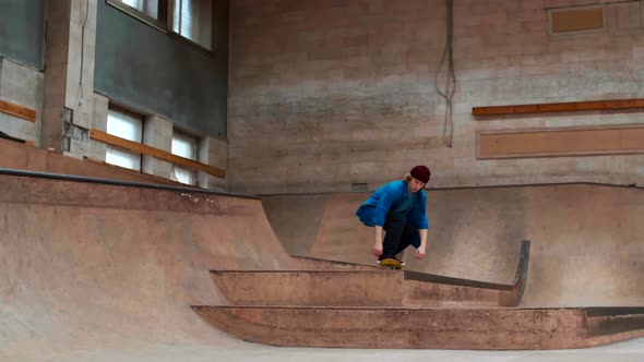 Skillful Male Skater Practicing Trick Ollie