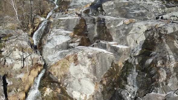 Breathtaking drone footage of a wonderful waterfall in the Swiss rocks