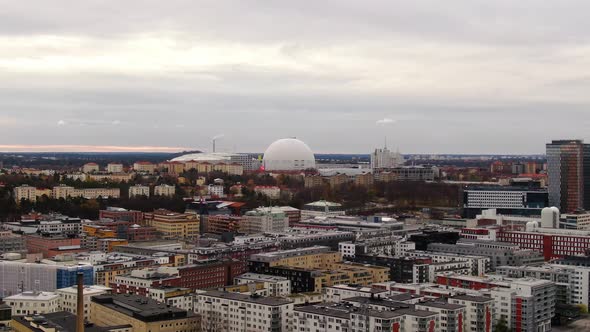 Aerial push in shot towards Ericsson Globe on overcast fall day