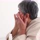 Elderly woman in bathrobe applying facial cream - VideoHive Item for Sale